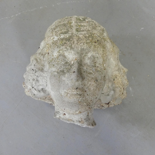 3434 - A weathered concrete Art Deco lady's head. Height 22cm.