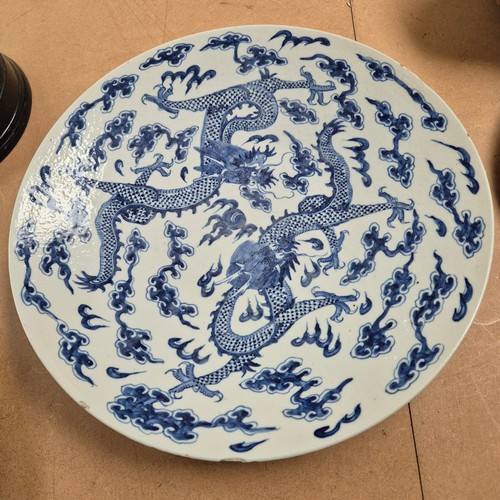 984 - A Chinese blue and white charger, with dragon decoration, diameter 37cm, with Qianlong? blue charact... 