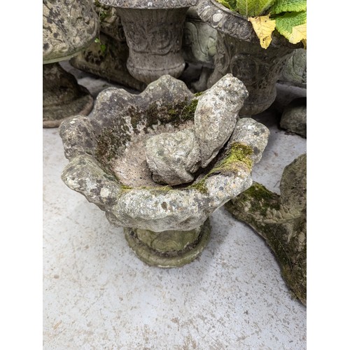 3352 - A weathered concrete garden urn, a boot, three bases and a gnome, height 45cm. (6)