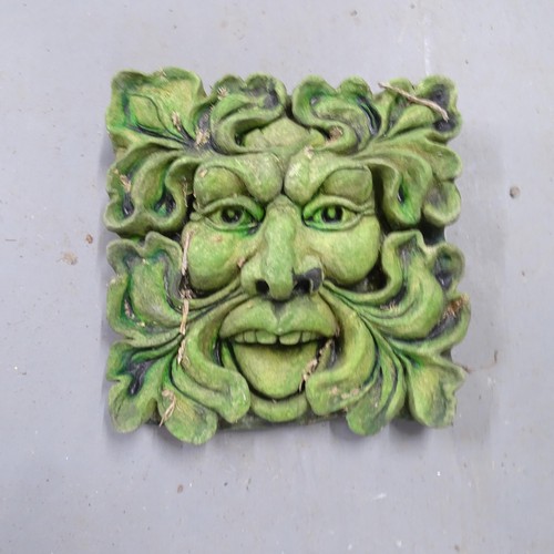 3435 - A painted cast stone Green Man wall plaque. 27x27cm.