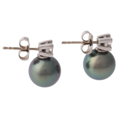 16 - A Pair of Black Cultured Pearl and Diamond Stud Earrings,

each comprising a Princess-cut diamond su... 