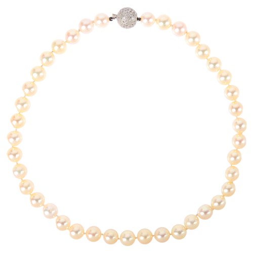 67 - A Pearl and Diamond Necklace,

comprising a single row of 9mm pearls, the sphere clasp pave set with... 