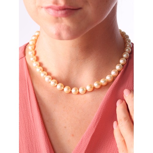 67 - A Pearl and Diamond Necklace,

comprising a single row of 9mm pearls, the sphere clasp pave set with... 