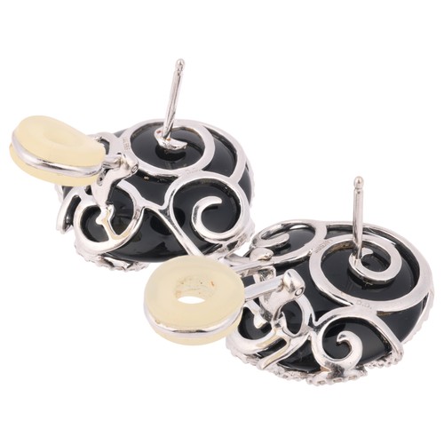 69 - A Pair of Onyx and Diamond Earrings,

the spheroid onyx panel mounted with diamond set spiral frame,... 