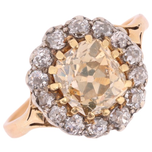 9 - An Antique Champagne Diamond and Diamond Cluster Ring,

set with one central cushion cut Champagne d... 