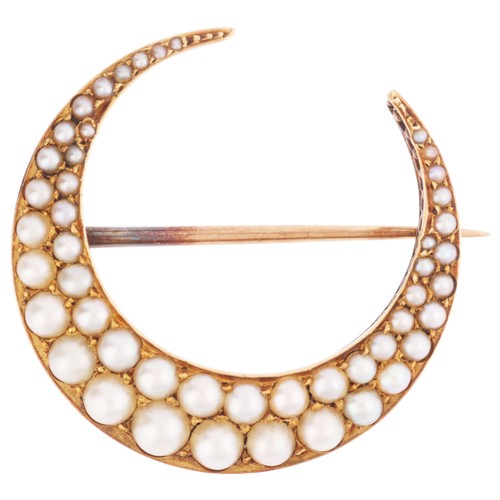 68 - An Antique Victorian Pearl Crescent Brooch,

circa 1890, set with two rows of graduated split pearls... 