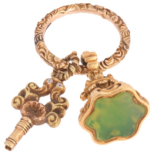 59 - An Antique Georgian Regency Fob,

circa 1820, comprising a shaped plain seal fob with inset green gl... 