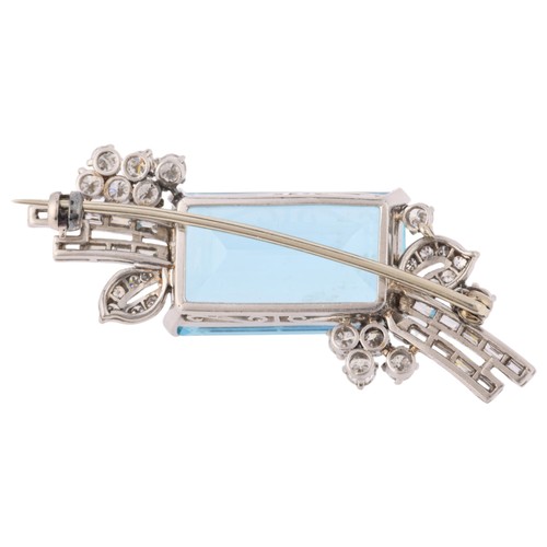 20 - An Aquamarine and Diamond Brooch,

circa 1950s, set with an elongated octagonal step cut aquamarine ... 