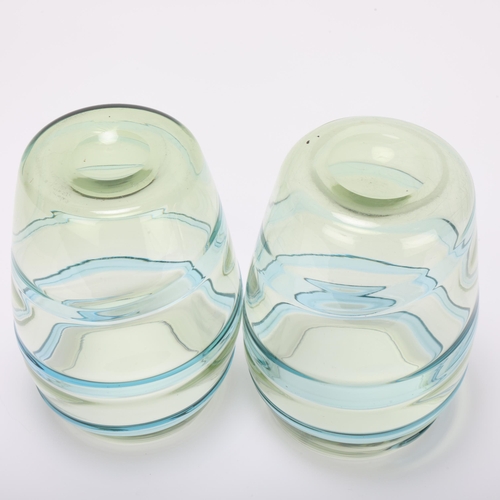 10 - BARNABY POWELL (1891-1939) for Whitefriars, a pair of pale blue and green swirl glass vases, height ... 