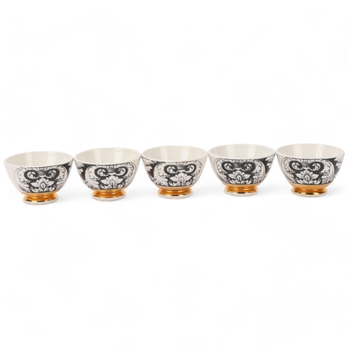 104 - A set of 5 PIERO FORNASETTI (1913-88) tea bowls, with gilded foot rim, makers marks to base, diamete... 