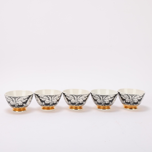 104 - A set of 5 PIERO FORNASETTI (1913-88) tea bowls, with gilded foot rim, makers marks to base, diamete... 