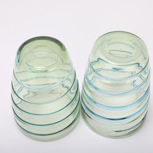 11 - BARNABY POWELL (1891-1939) for Whitefriars, a pair of pale blue and green swirl barrel form glass va... 