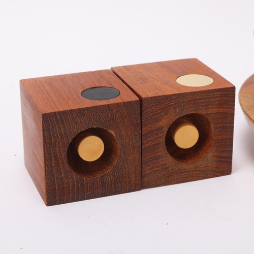 118 - A mid 20th century teak salt and pepper set together with a Wyncraft teak based egg cup stand with l... 