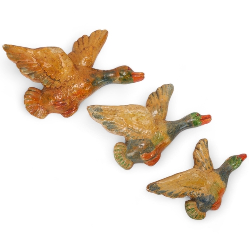 125 - A set of mid 20th century painted plaster wall hanging ducks, no makers marks, largest length 26cm