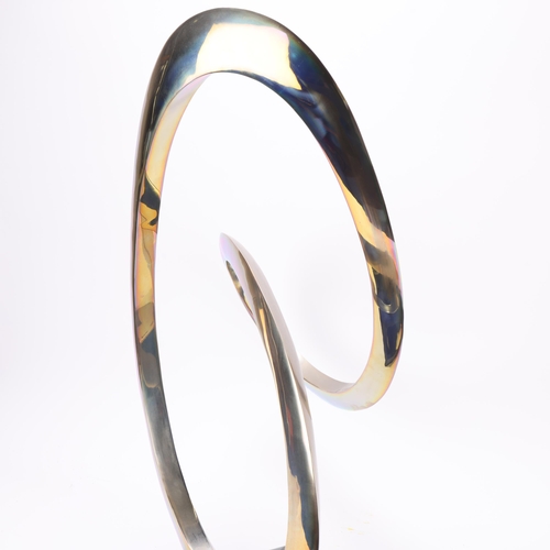 54 - A polished steel Infinity Curve sculpture on polished black granite base, height 58cm