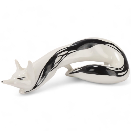 87 - MIECZYSLAW NARUSZEWICZ for Cmielow, Poland, a 1950's porcelain stalking fox, numbered to base w-17/2... 