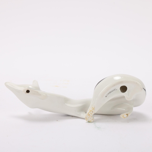 87 - MIECZYSLAW NARUSZEWICZ for Cmielow, Poland, a 1950's porcelain stalking fox, numbered to base w-17/2... 