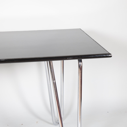 122 - A 1930s modernist Art Deco dining table or desk, the hair pin  tubular steel legs supporting a woode... 