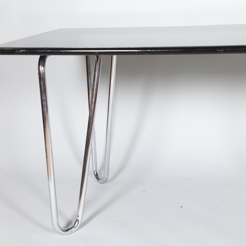 122 - A 1930s modernist Art Deco dining table or desk, the hair pin  tubular steel legs supporting a woode... 