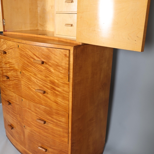 15 - A fine quality handmade 1930s Art Deco tall boy, the concave front cabinet on bow front chest, the f... 