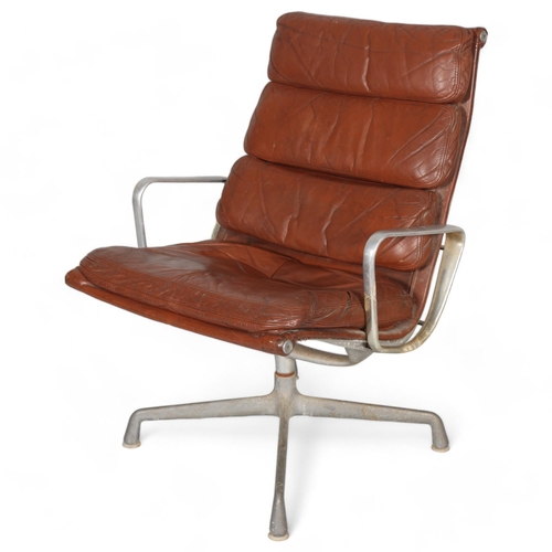 245 - RAY & CHARLES EAMES, a 1970s' Herman Miller high back Soft Pad Eames Group chair with brown leather ... 