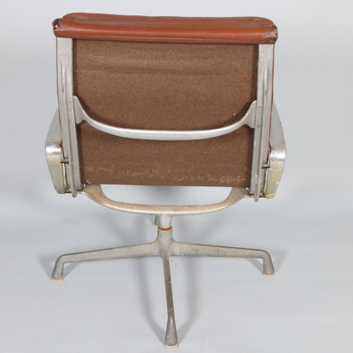 245 - RAY & CHARLES EAMES, a 1970s' Herman Miller high back Soft Pad Eames Group chair with brown leather ... 