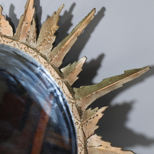 59 - A late 20th century welded steel and patinated sunburst mirror, diameter 90cm