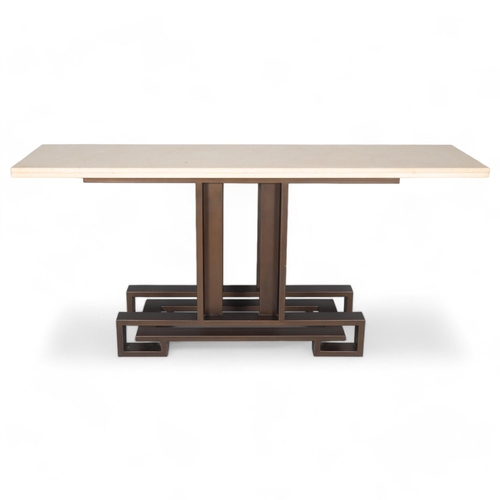 95 - A high-end Villiers Brothers Brooklyn console table, the limestone top supported on a bronzed steel ... 