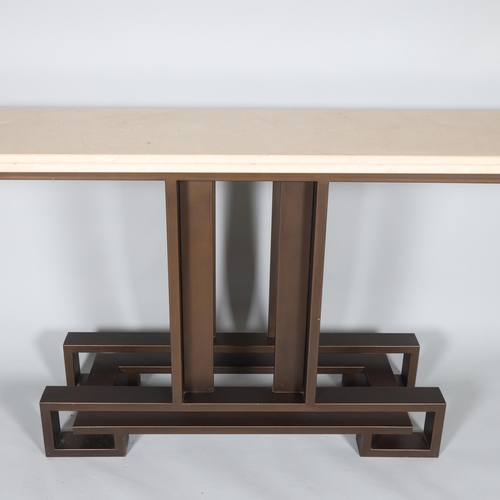 95 - A high-end Villiers Brothers Brooklyn console table, the limestone top supported on a bronzed steel ... 