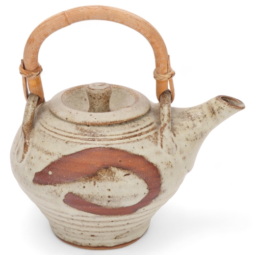 193 - A Mousehole Pottery, Cornwall stoneware teapot with cane handle, makers mark to base, length 19cm