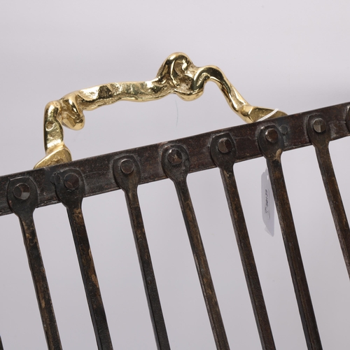 196 - DAVID MARSHALL (b.1942), Scotland, a hand wrought log basket or magazine rack, Brutalist style brass... 