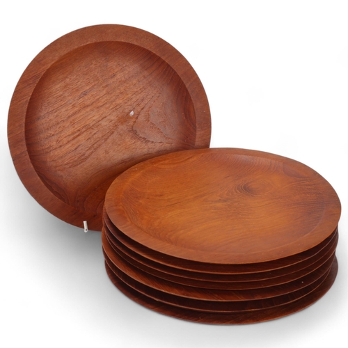 205 - A set of 8 mid-century Danish design teak platters, diameter 26cm