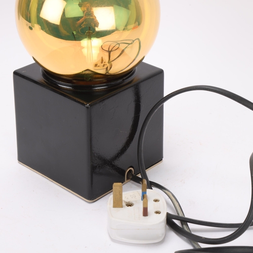 234 - A Philips design coated steel cube lamp with gilded globe bulb, overall height 22cm