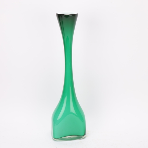 257 - A mid 20th century hand blown green glass vase with white interior, polished pontil to base, height ... 