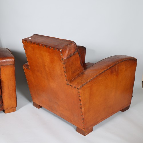 44 - A Pair of mid 20th century leather club chairs, in the style of JACQUES ADNET, height 75cm, depth 90... 