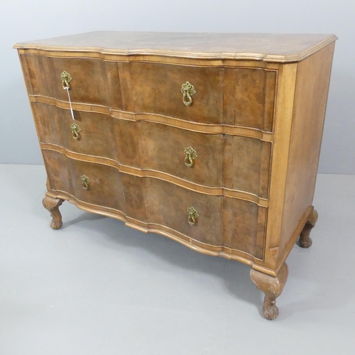 2101 - An early 20th century burr walnut veneered chest of three long drawers, raised on cabriole legs with... 