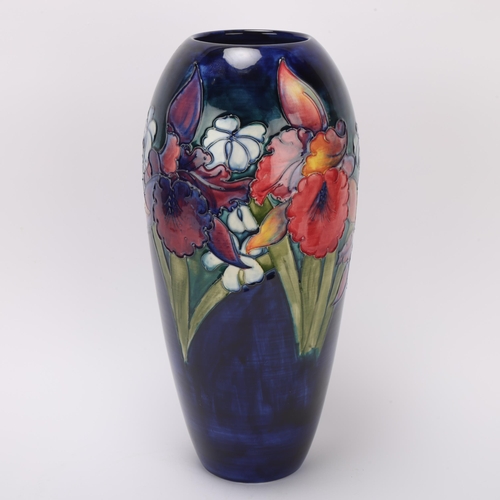 307 - A large Moorcroft Orchid pattern vase, piped frilled and slipper orchids on blue glaze, signed and s... 