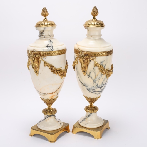 317 - Pair of Calacatta marble and ormolu ornamental urns, probably late 19th century, with relief cast ra... 