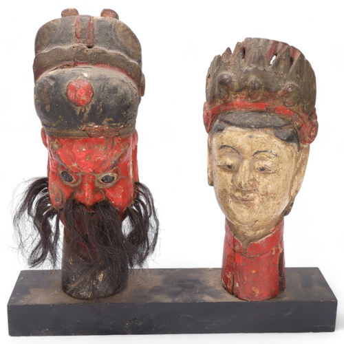 360 - Pair of Chinese carved and painted wood puppet masks on stand, height 38cm