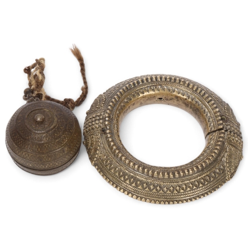 362 - A heavy cast-bronze 2-section slave bangle, diameter 15cm, and an 18th century bronze ball-shaped bo... 