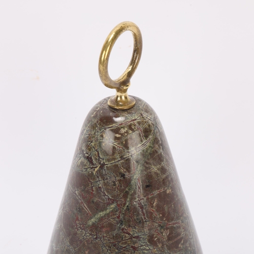 387 - Heavy 19th century serpentine marble doorstop, with brass ring handle, height 22cm