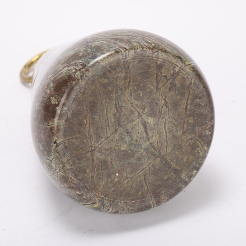 387 - Heavy 19th century serpentine marble doorstop, with brass ring handle, height 22cm