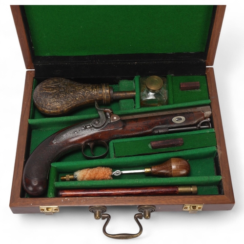 393 - An Antique percussion pistol, late 18th/early 19th century, by Stanton & Son of Chester, with carved... 