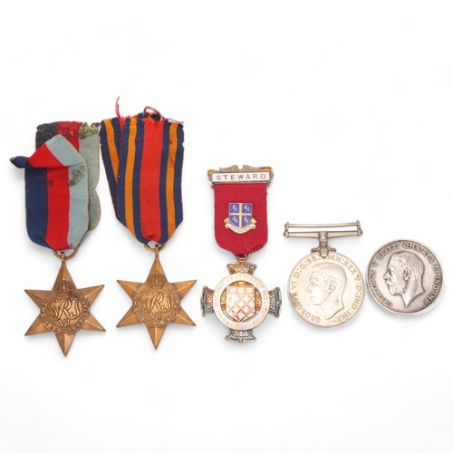 417 - A First World War medal to G24345 PTE. VG Everest, The Queens Reg, 3 Second World War medals and a s... 