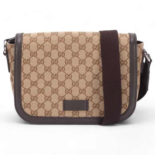 418 - A Gucci medium sized crossbody messenger bag, monogram fabric and dark brown leather trim, with Gucc... 