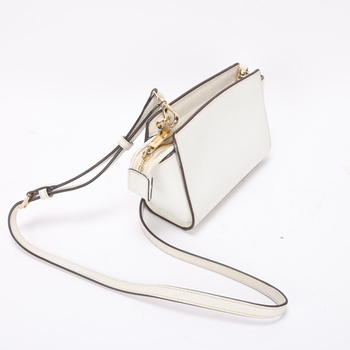 426 - A Michael Kors textured white leather small size shoulder bag, with MK monogram lining, bag length 1... 