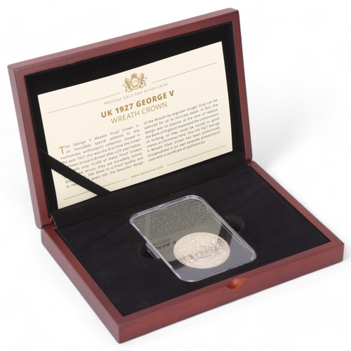 442 - A 1927 George V Wreath proof crown, in sealed capsule, CPM Coins presentation box and certificate