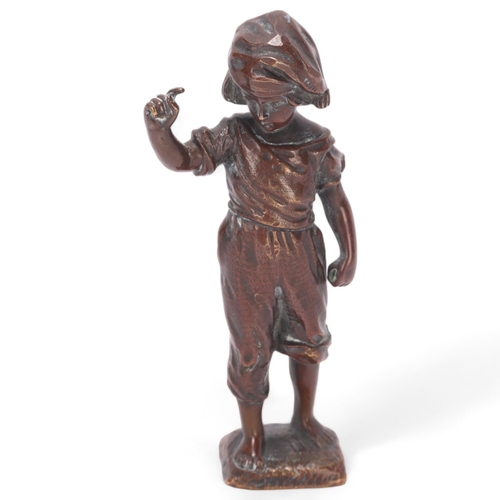 525 - A small patinated bronze figure of a child, indistinct signature, height 10cm