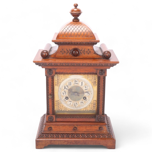 529 - A 19th century Continental walnut-cased 8-day mantel clock, height 44cm