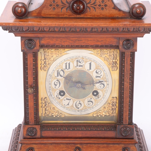 529 - A 19th century Continental walnut-cased 8-day mantel clock, height 44cm